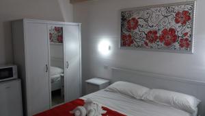 Posteľ alebo postele v izbe v ubytovaní B&B LADY JOLANDA