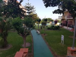 A garden outside Apartamentos Minerva- Jupiter