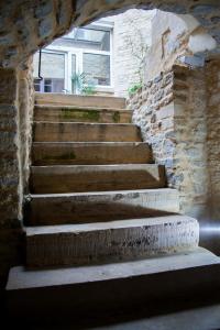 a set of stairs in a stone wall at Villa Des Ursulines in Bayeux