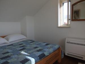 Katil atau katil-katil dalam bilik di Holiday Home Katia