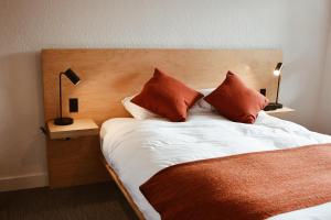 Ένα ή περισσότερα κρεβάτια σε δωμάτιο στο Heliotrope Hotel