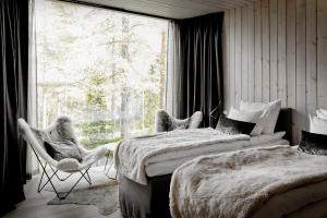 Postel nebo postele na pokoji v ubytování Arctic TreeHouse Hotel