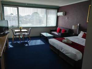Postel nebo postele na pokoji v ubytování Parkdale Motor Inn + 29 fotografií