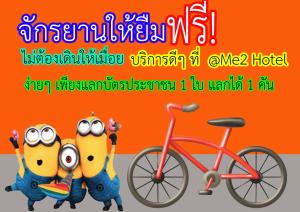 a cartoon character standing next to a red bike at @Me2 Hotel in Phitsanulok
