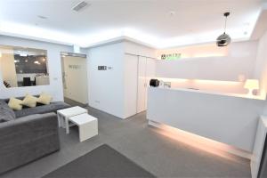 a living room with a couch and a table at Inn Cube - Ximen in Taipei