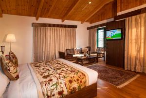 Voodi või voodid majutusasutuse Lemon Tree Hotel Srinagar toas