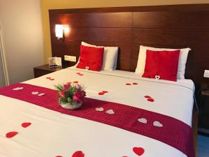 Voodi või voodid majutusasutuse Tulip Inn Sainte Clotilde, La Réunion toas