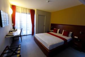Voodi või voodid majutusasutuse Tulip Inn Sainte Clotilde, La Réunion toas