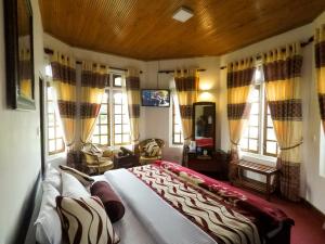 Giường trong phòng chung tại Nuwara Eliya Hills Rest