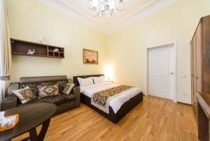 Postel nebo postele na pokoji v ubytování Kiev Centre Apartments