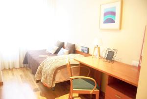 Posteľ alebo postele v izbe v ubytovaní Apartamentos Turisticos ARCH