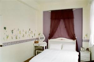 小城堡民宿Little Castle hotel 19窩窩近東大門夜市好停車房間的床