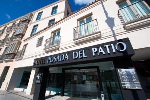 a store front of a building with a sign on it at Vincci Selección Posada del Patio in Málaga