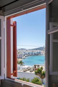 a window with a view of the ocean at Arodou Studio and Apartment in Mikonos