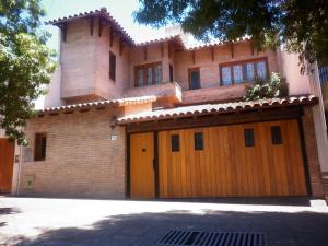 a house with two garage doors in front of it at 816 B&B in Mendoza
