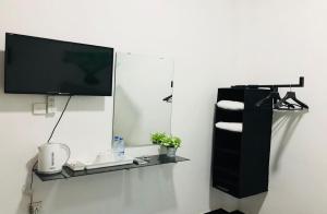 TV a/nebo společenská místnost v ubytování House of Seya