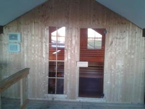 a house being constructed with a door and windows at Luxus Chalet mit Terrasse, sehr ruhig in Kollmar in Kollmar