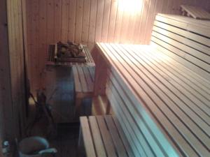 a room with a bed and a table in it at Luxus Chalet mit Terrasse, sehr ruhig in Kollmar in Kollmar