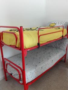 two bunk beds sitting on a shelf in a room at mare e arte in Marina di Pisa