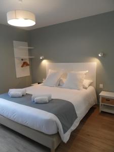 Ένα ή περισσότερα κρεβάτια σε δωμάτιο στο L'Escale