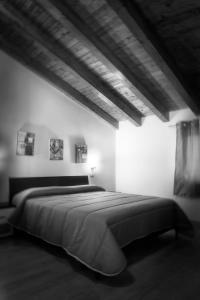 a bedroom with a large bed in a room at Asaro Camere in Campobello di Licata