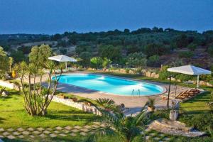 an image of a swimming pool at a resort at Trulli Fogliarella in Ostuni