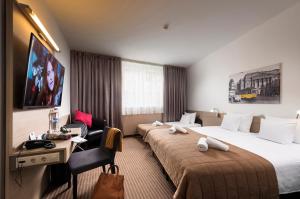 Ένα ή περισσότερα κρεβάτια σε δωμάτιο στο Bo18 Hotel Superior