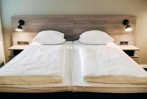 Letto o letti in una camera di Copenhagen Go Hotel
