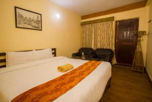Ein Bett oder Betten in einem Zimmer der Unterkunft Langtang View Nagarkot Bed and Breakfast