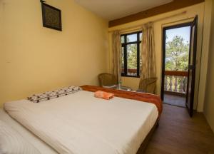 Ein Bett oder Betten in einem Zimmer der Unterkunft Langtang View Nagarkot Bed and Breakfast