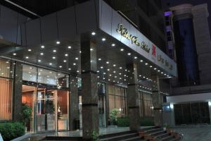 a building with a sign on the front of it at Kabul Star Hotel & Restaurant in Shīrpūr