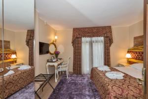 Łóżko lub łóżka w pokoju w obiekcie By Murat Royal Hotel Galata