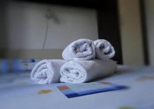 a pile of towels sitting on top of a bed at Petar in Krk +7 photos