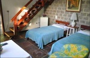 Postel nebo postele na pokoji v ubytování Quilombo Hotel Fazenda
