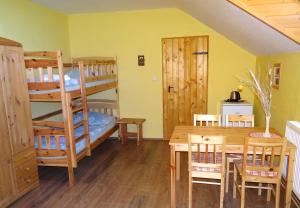 Una cama o camas en una habitación de Farma Růžová