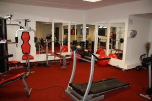 a gym with a lot of equipment in a room at Apártmany Velká Lomnica B4-AD1 in Veľká Lomnica