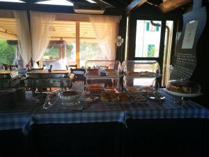 a table with food on a blue and white table cloth at Locanda le Boscarecce in Castelfiorentino