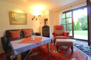 a living room with a table and a couch at FeWo Gudrun in Garmisch-Partenkirchen