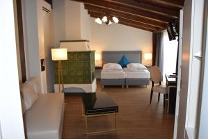 
Ein Bett oder Betten in einem Zimmer der Unterkunft Atel Hotel Lasserhof
