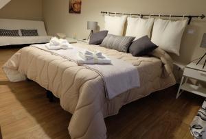 Postel nebo postele na pokoji v ubytování La Fara B&B