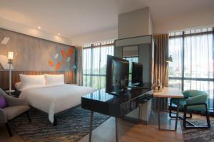 ibis Styles Medan Pattimura客房内的一张或多张床位