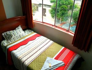 Letto o letti in una camera di Hospedaje Central Piura