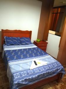 Letto o letti in una camera di Hospedaje Central Piura
