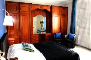 Postel nebo postele na pokoji v ubytování Appart'hôtel et chambres Lens