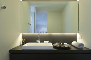 a bathroom with a sink and a large mirror at Maison Wyck in Maastricht +14 photos