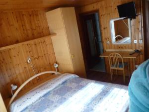 Postel nebo postele na pokoji v ubytování Hotel Fior di Roccia