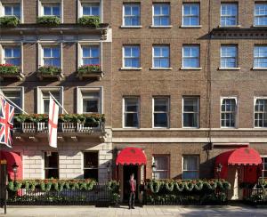 a man standing in front of a building at The Chesterfield Mayfair in London