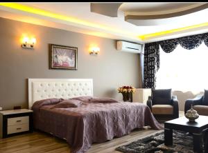 Łóżko lub łóżka w pokoju w obiekcie Döğme Hotel Londra Camping