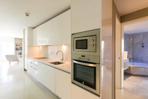 Kuchyň nebo kuchyňský kout v ubytování Apartments Pateo - Lisbon Lounge Suites
