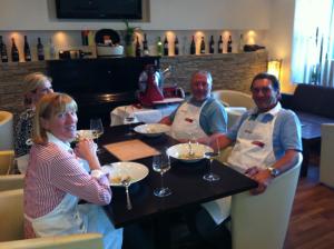 a group of people sitting at a table with wine glasses at Hotel Restaurant Pusswald in Hartberg